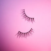 A floating lash shot of Salon Perfect Wisper Wink 683 lash out of packaging